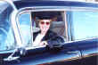 Lilian Shepard behind the wheel of the Grand's 1959 Fleetwood