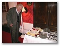 Bill admires his 90th birthday cake